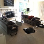 Lucite chairs, lavender velvet couches