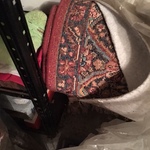 large rolled vintage rug