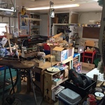 packed garage with small hand tools and crafting, antique jigsaw