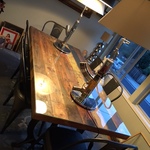 wooden duck reclaimed wooden table & Philippe Starck lamps